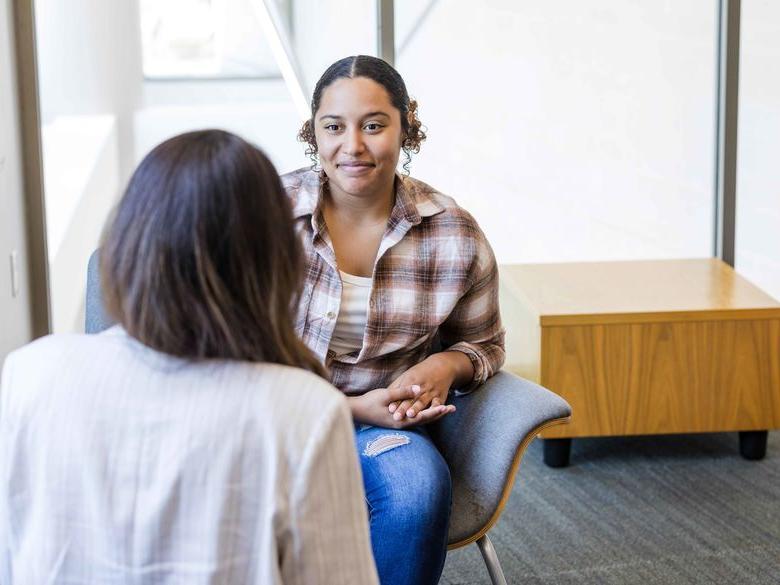 student talking to counselor 