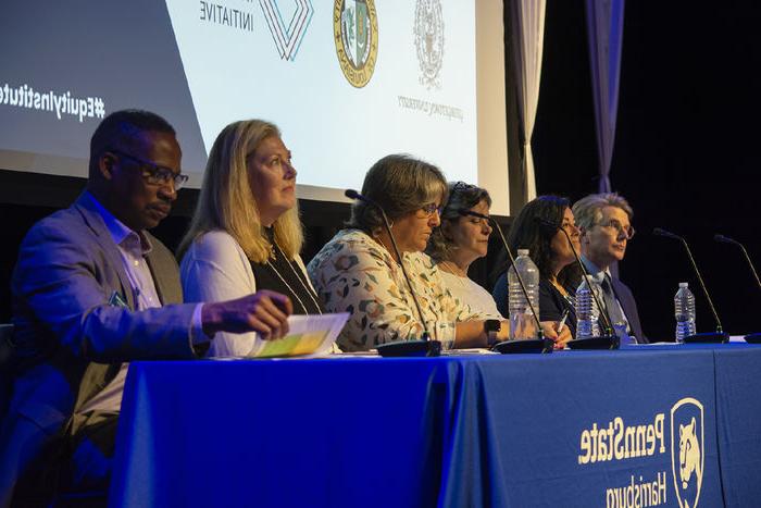 Penn Staters host a workshop panel on a stage at the Penn State Harrisburg campus