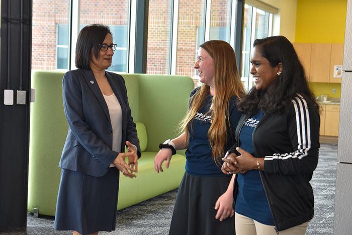 Two Lion Ambassadors speaking to Bendapudi