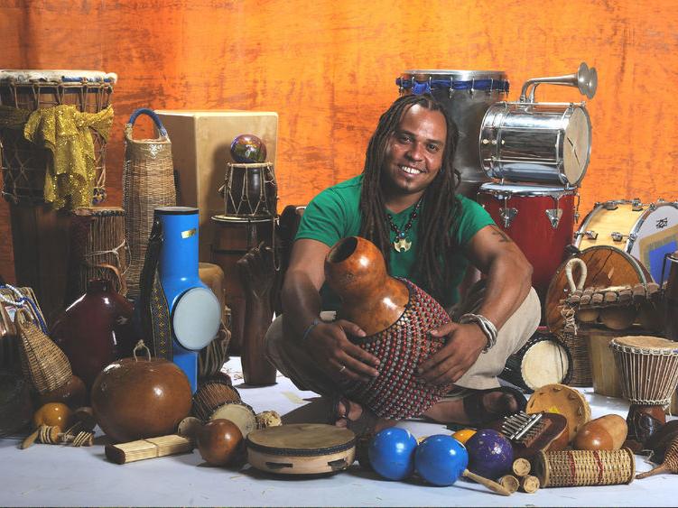 Man surrounded by percussion instruments